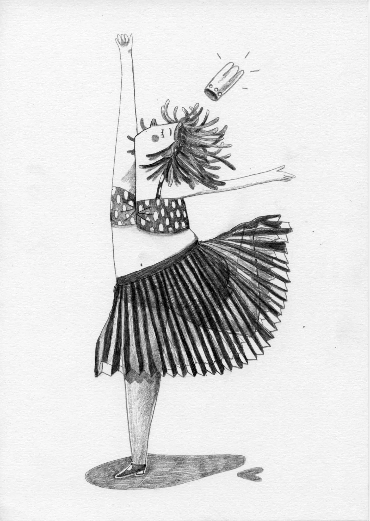 Dancer in a black pleated skirt poses with one fist raised, a small object flying past her head