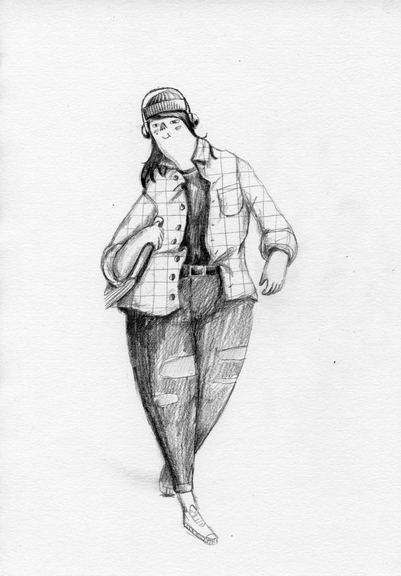 Woman in a beanie, checked jacket and ripped jeans strolls along with a book under her arm