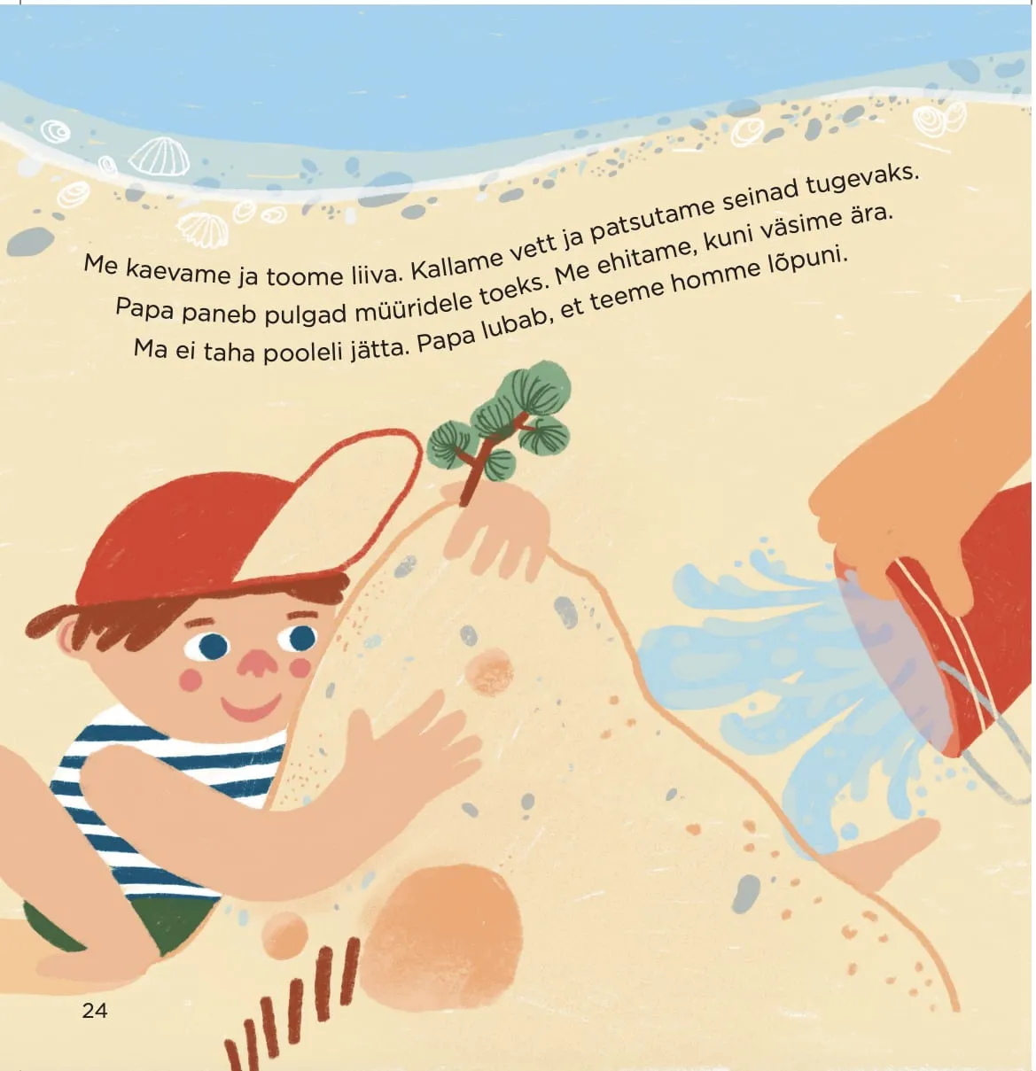 Boy in a red cap pats a huge sand mound while an adult pours water from a red bucket beside him